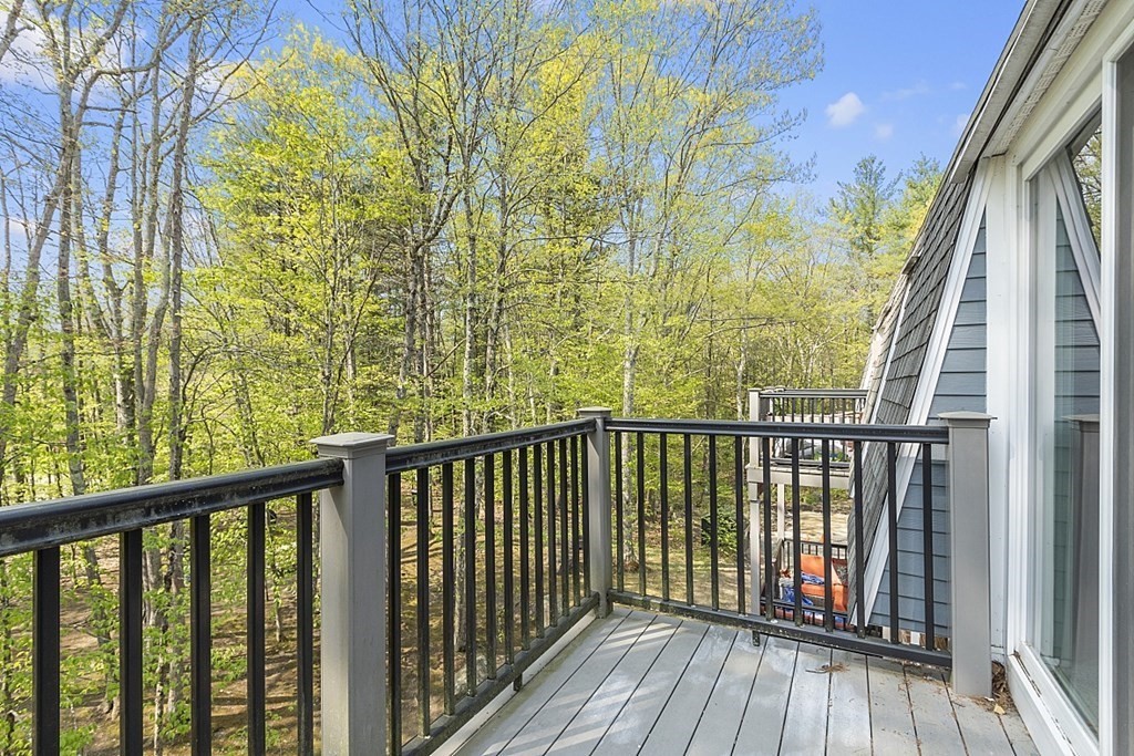 27 Ernest Avenue, Unit 24 Exeter, NH 03833 - Photo 34 of 38 a view of balcony with wooden floor and fence