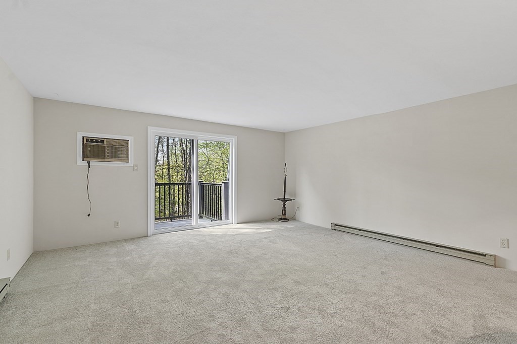27 Ernest Avenue, Unit 24 Exeter, NH 03833 - Photo 5 of 38 a view of an empty room with a window