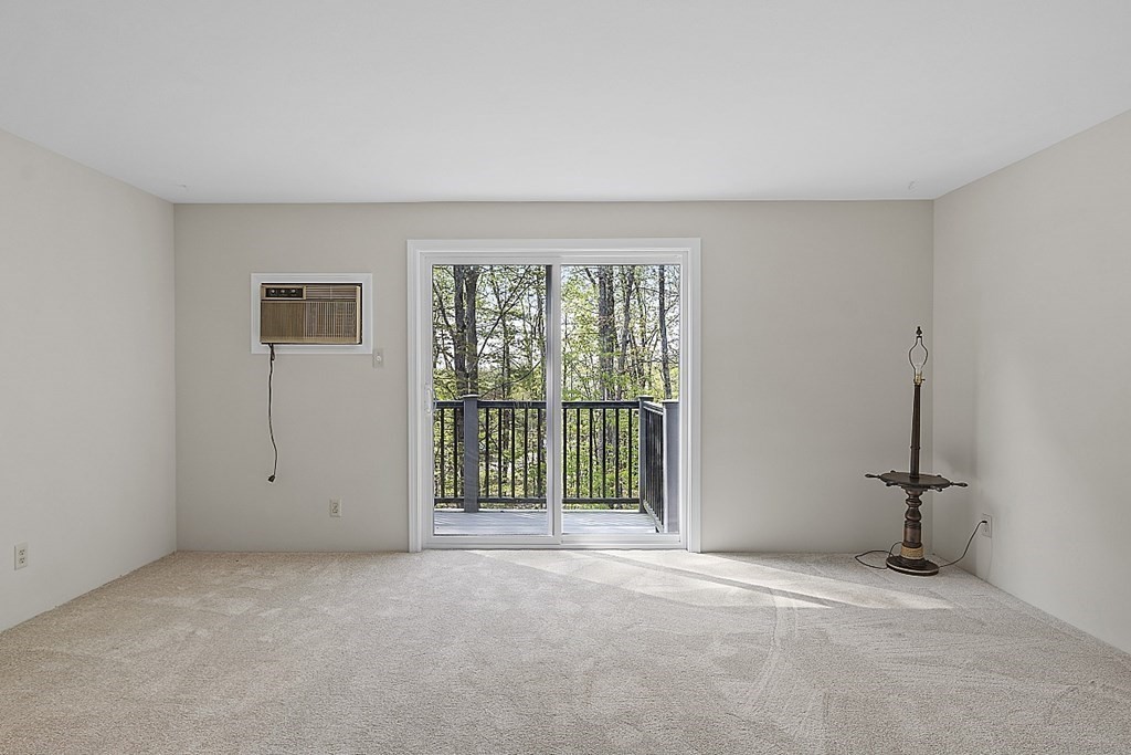 27 Ernest Avenue, Unit 24 Exeter, NH 03833 - Photo 7 of 38 a view of an empty room with a window