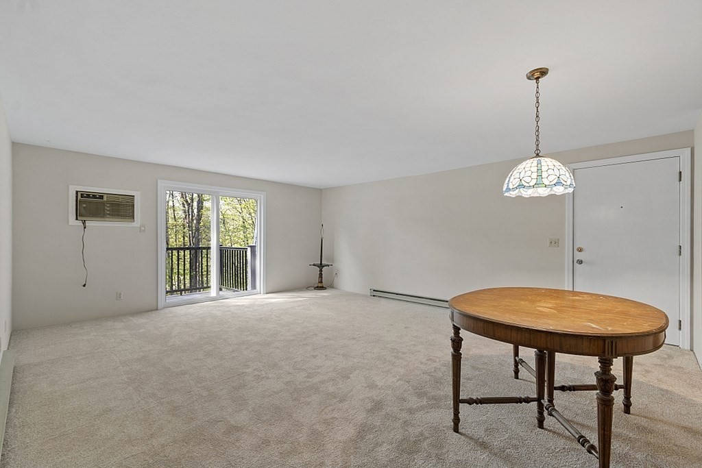 27 Ernest Avenue, Unit 24 Exeter, NH 03833 - Photo 8 of 38 a view of a room with a table and chairs
