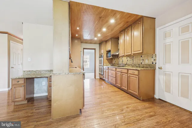 a view of a livingroom with wooden floor