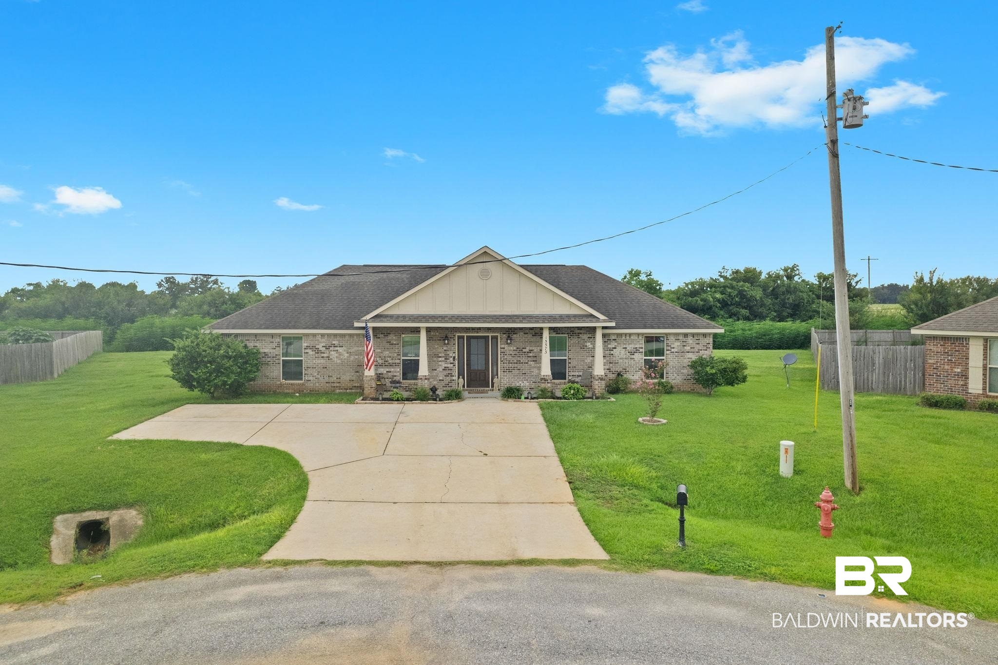 15573 Talus Court Foley, AL 36535 - Photo 38 of 50 View of front facade with a front lawn