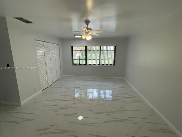 a bathroom with a double vanity sink mirror and shower
