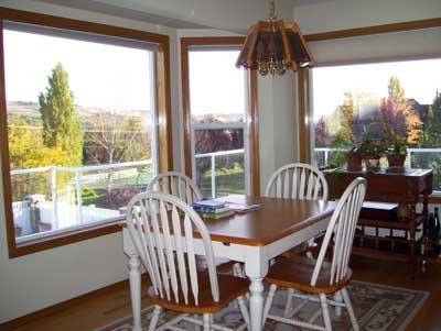 528 South Hennessy Road Yakima, WA 98908 - Photo 13 of 26 a view of a dining room with furniture window and wooden floor