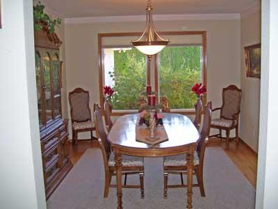 528 South Hennessy Road Yakima, WA 98908 - Photo 14 of 26 a dining room with furniture a chandelier and wooden floor