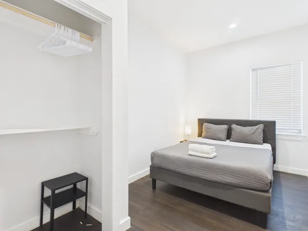 a bedroom with a bed and a table