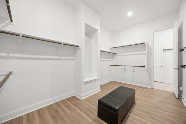 a white toilet sitting next to a bathroom sink