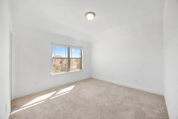wooden floor and window in an empty room