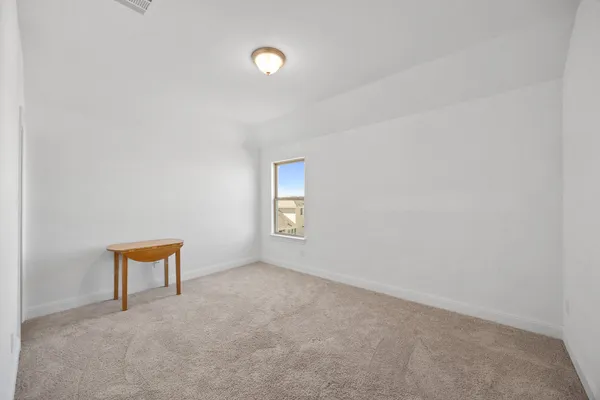 a view of a house with backyard porch and sitting area