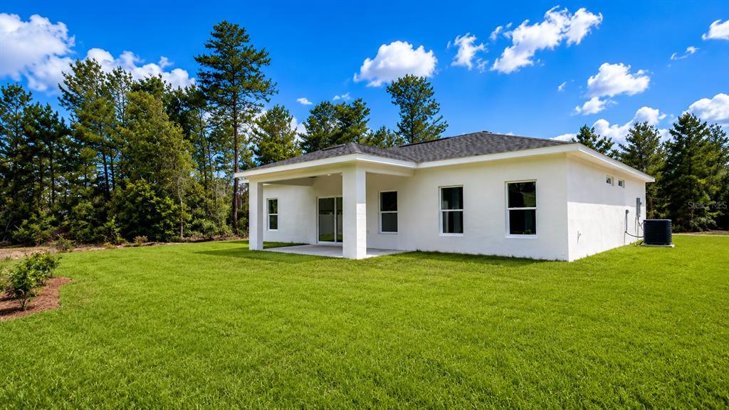 3620 Southwest 127th Lane Road Ocala, FL 34473 - Photo 5 of 23 a view of a house with a yard