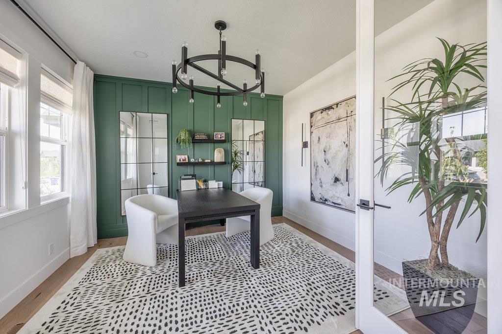 7385 West Flathead Lk Street Eagle, ID 83616 - Photo 3 of 14 Dining room featuring a chandelier, french doors, and a desk