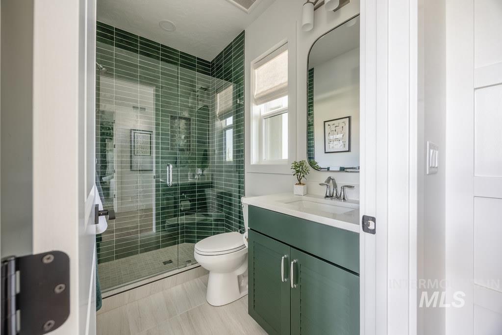 7385 West Flathead Lk Street Eagle, ID 83616 - Photo 5 of 14 Full bathroom featuring vanity and a stall shower