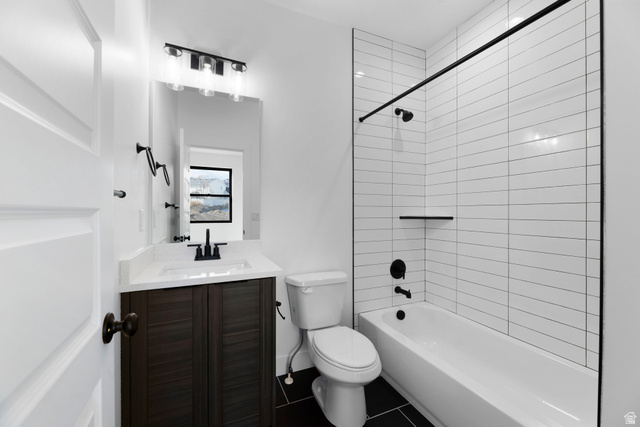 14392 South Champ Cove Draper, UT 84020 - Photo 21 of 31 Full bathroom featuring shower / tub combination, vanity, and dark tile patterned flooring