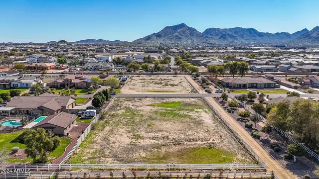 an aerial view of residential houses and outdoor space