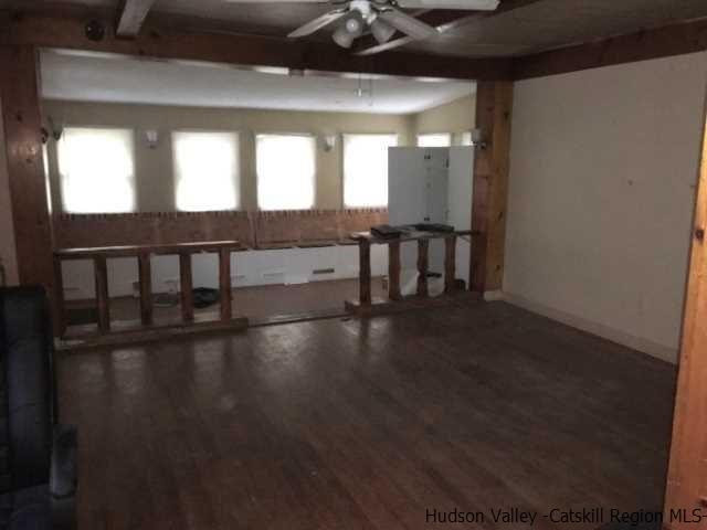 12 Clove Road Fishkill, NY 12524 - Photo 6 of 11 a view of empty room with wooden floor and fan