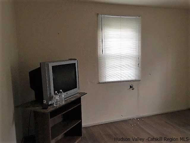 12 Clove Road Fishkill, NY 12524 - Photo 8 of 11 a living room with furniture and flat screen tv
