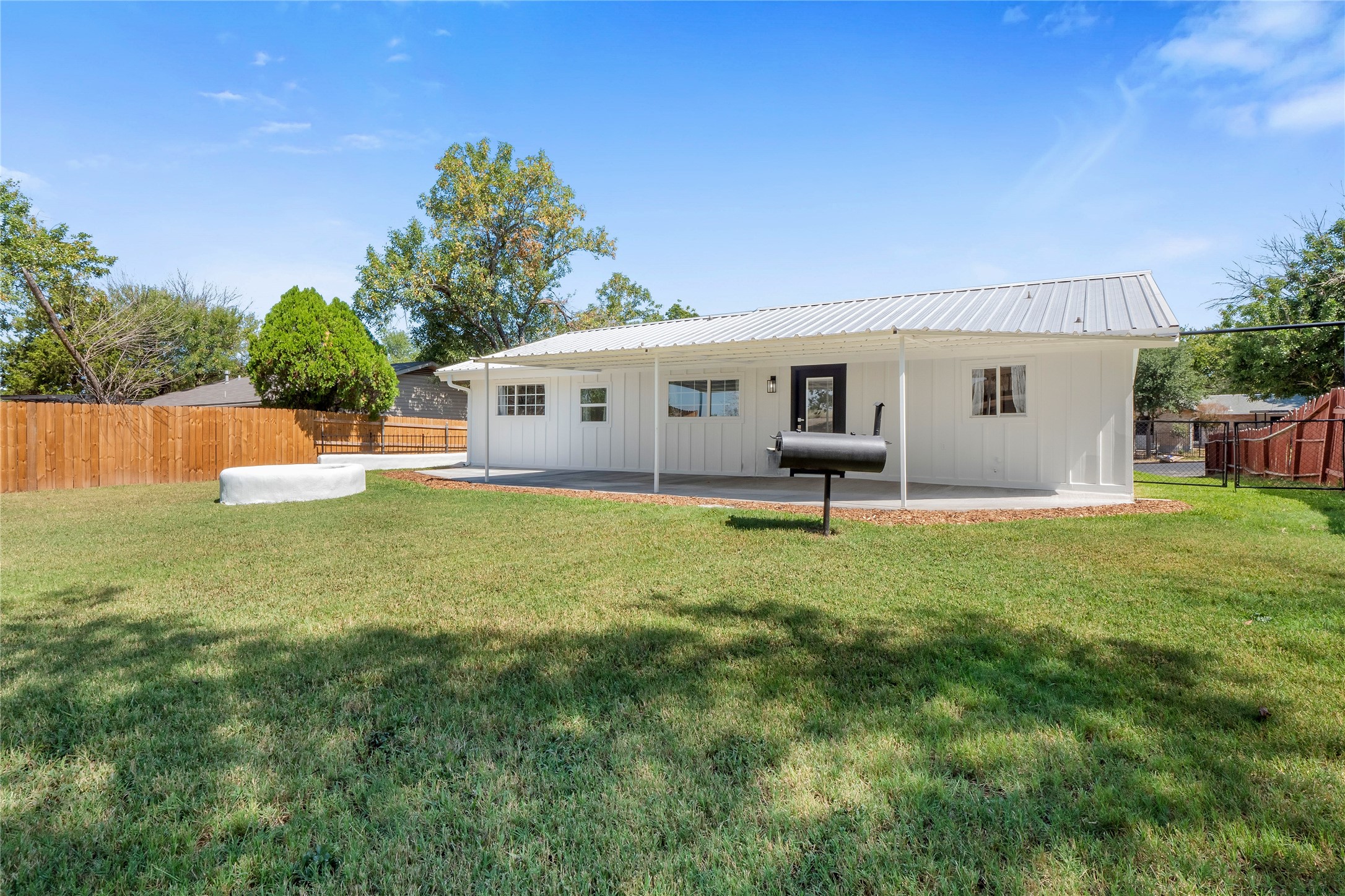 8007 Colony Loop Drive Austin, TX 78724 - Photo 30 of 40 Covered patio and built-in fire pit create an inviting outdoor gathering space.