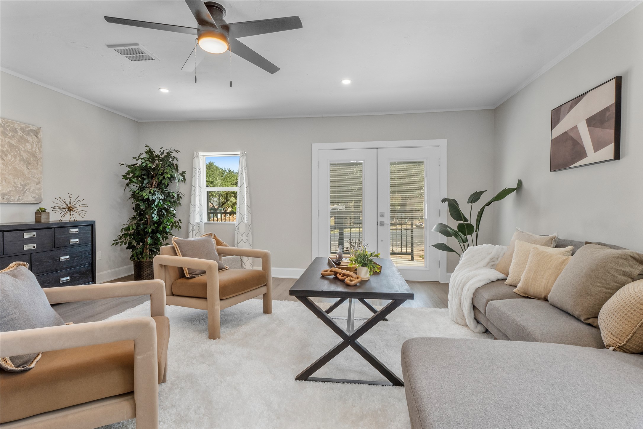8007 Colony Loop Drive Austin, TX 78724 - Photo 3 of 40 Light-filled living room with French doors, recessed lighting, and an easy, welcoming vibe.