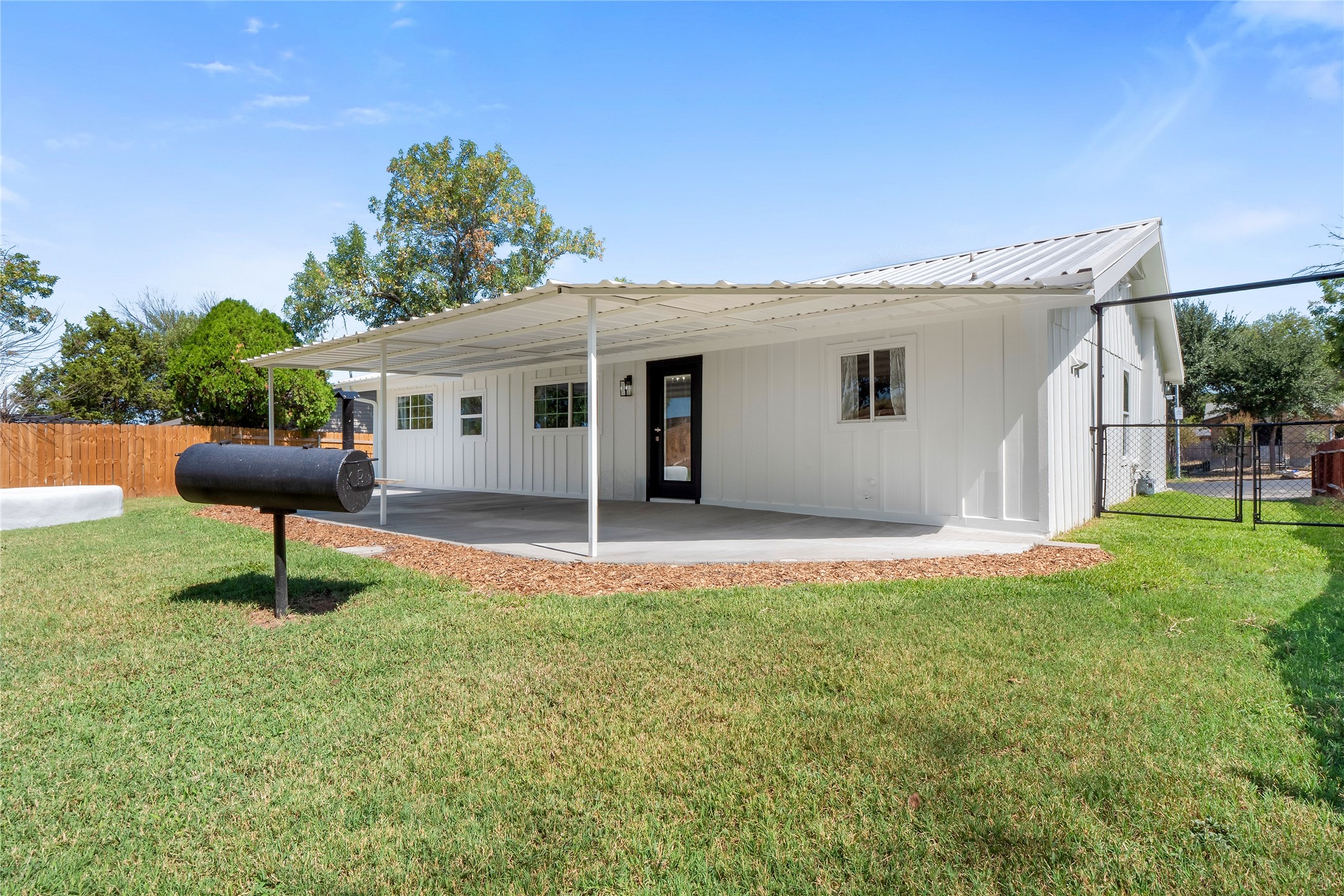 8007 Colony Loop Drive Austin, TX 78724 - Photo 32 of 40 Covered back patio with durable metal roof and direct exterior access—perfect for shaded hangouts and weekend hosting.
