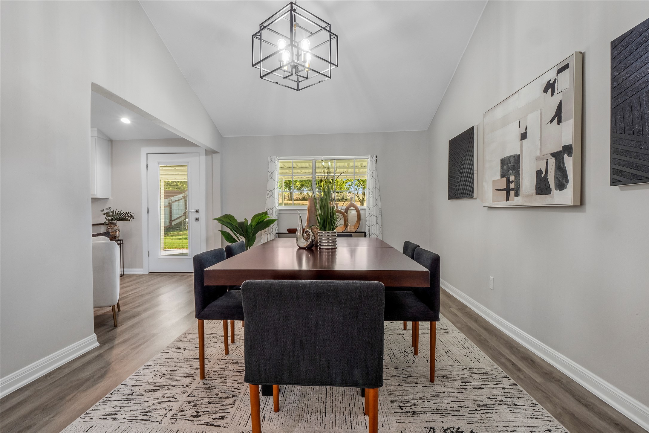 8007 Colony Loop Drive Austin, TX 78724 - Photo 7 of 40 Vaulted dining space with clean lines and seamless flow to the kitchen and backyard — perfect for hosting or everyday meals.