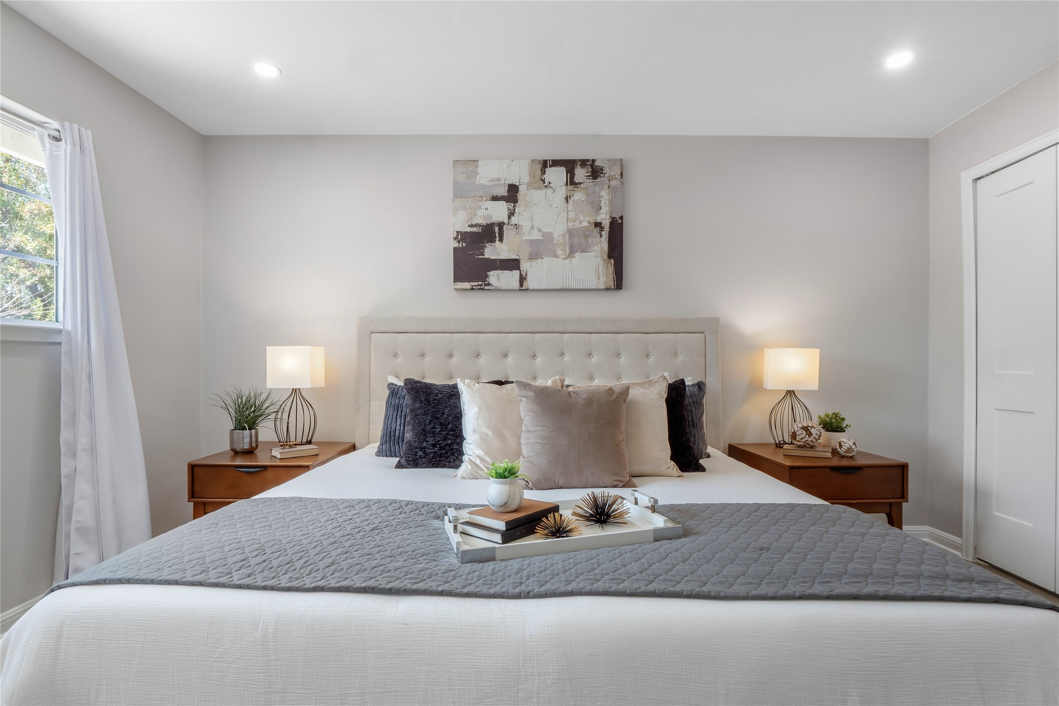 8007 Colony Loop Drive Austin, TX 78724 - Photo 8 of 40 Calm and spacious primary suite with soft natural light, recessed lighting, and a private en suite bath.