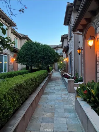 a front view of a house with lots of green space