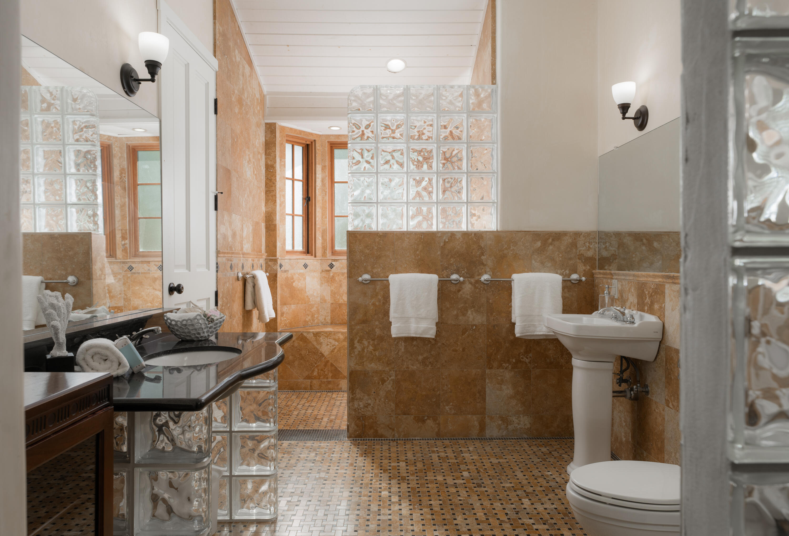 690 San Ysidro Road Montecito, CA 93108 - Photo 14 of 34 a bathroom with a granite countertop sink a toilet and shower