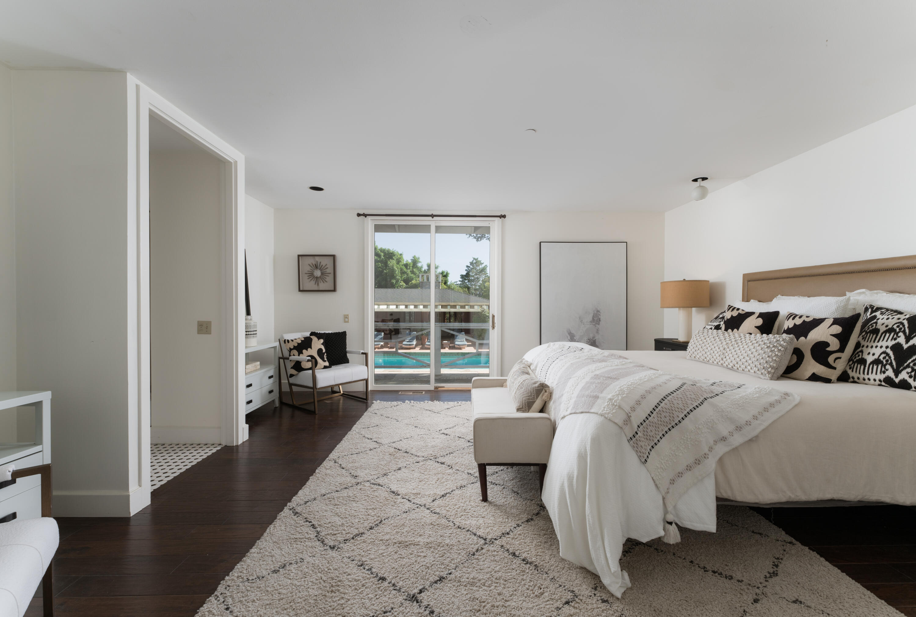 690 San Ysidro Road Montecito, CA 93108 - Photo 15 of 34 a bedroom with bed couch and a large window