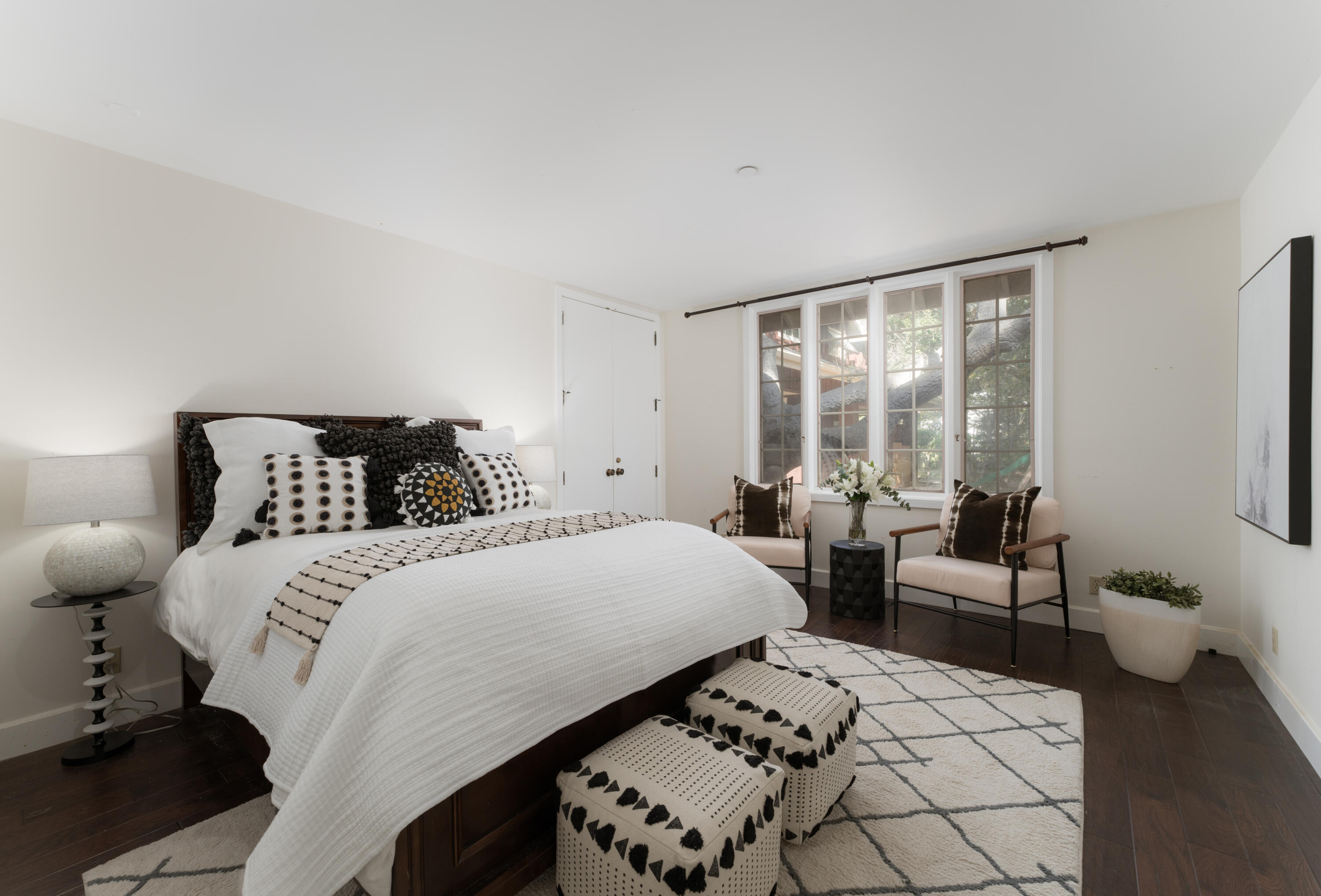 690 San Ysidro Road Montecito, CA 93108 - Photo 17 of 34 a bedroom with a bed and wooden floor