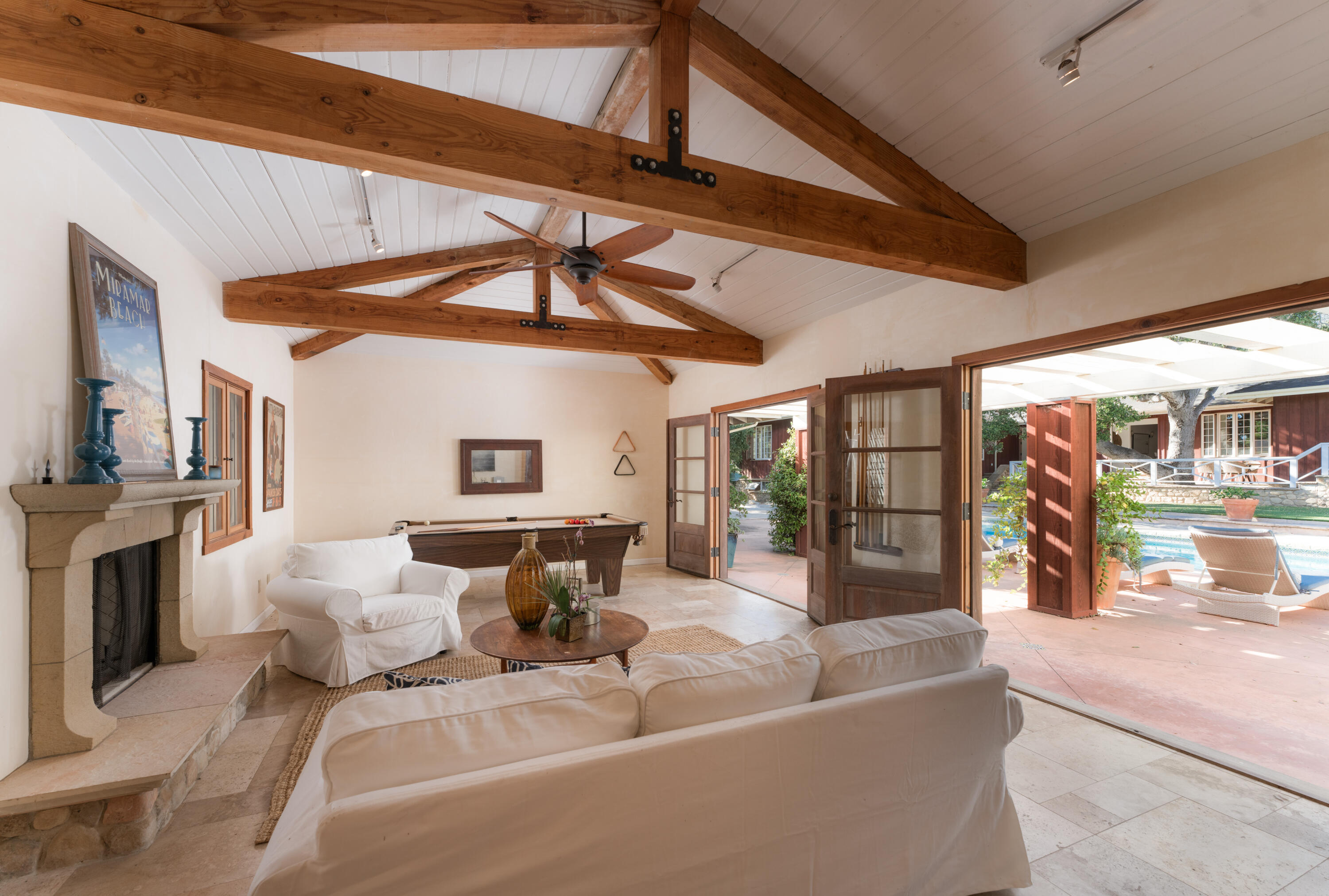 690 San Ysidro Road Montecito, CA 93108 - Photo 22 of 34 a living room with furniture and a fireplace