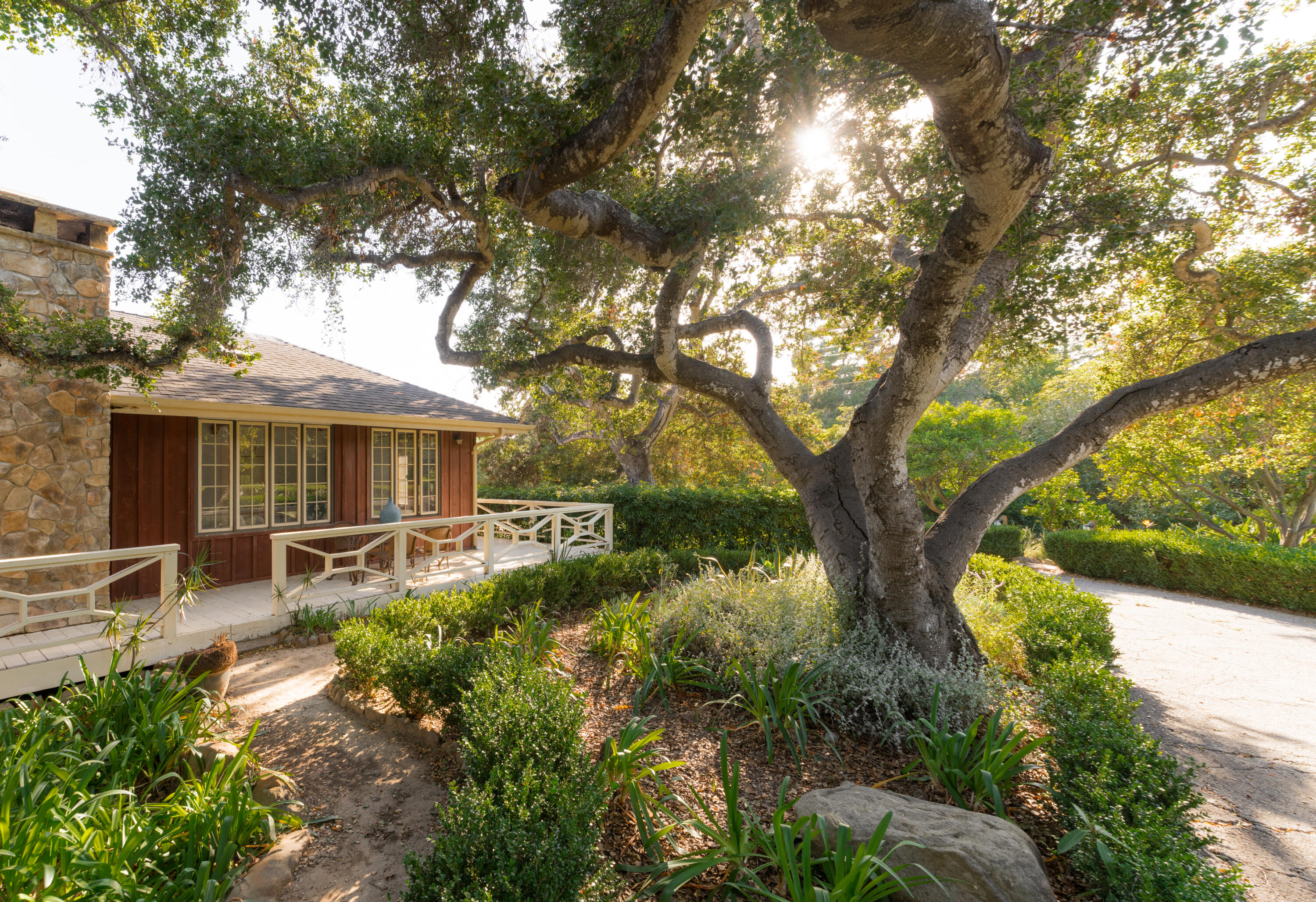 690 San Ysidro Road Montecito, CA 93108 - Photo 26 of 34 a front view of a house with garden