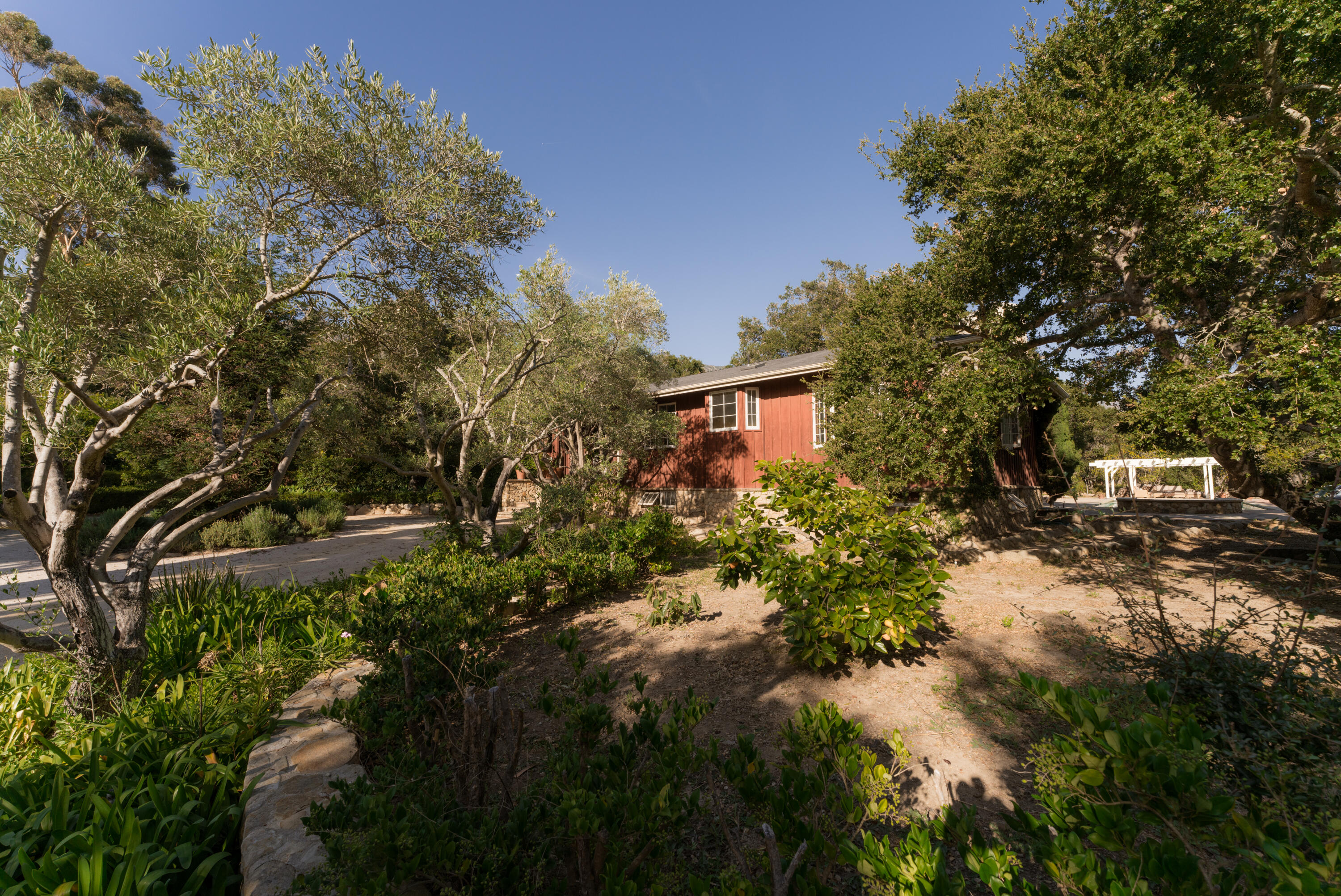690 San Ysidro Road Montecito, CA 93108 - Photo 30 of 34 a view of a house with a yard
