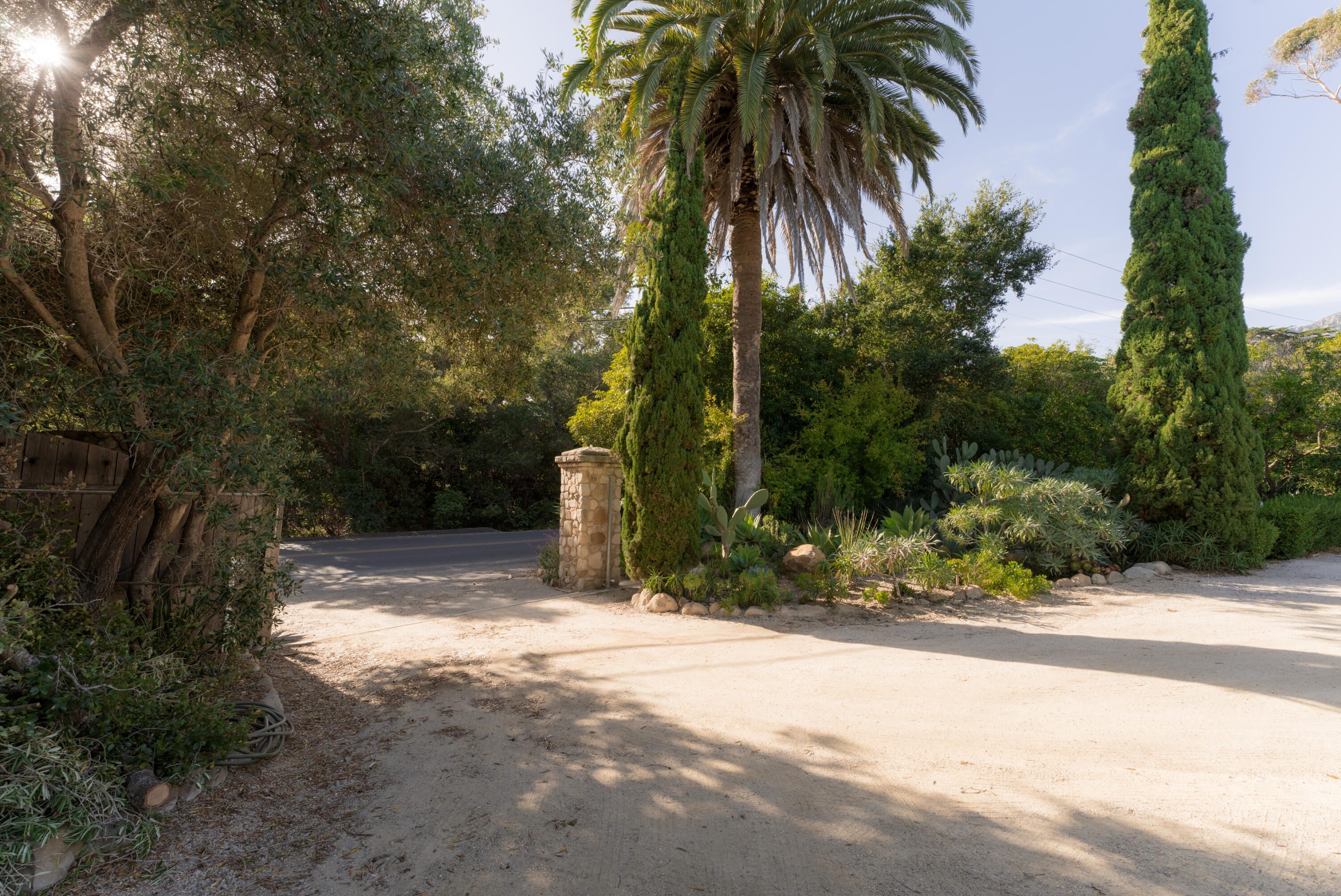 690 San Ysidro Road Montecito, CA 93108 - Photo 31 of 34 a view of a yard with plants and trees