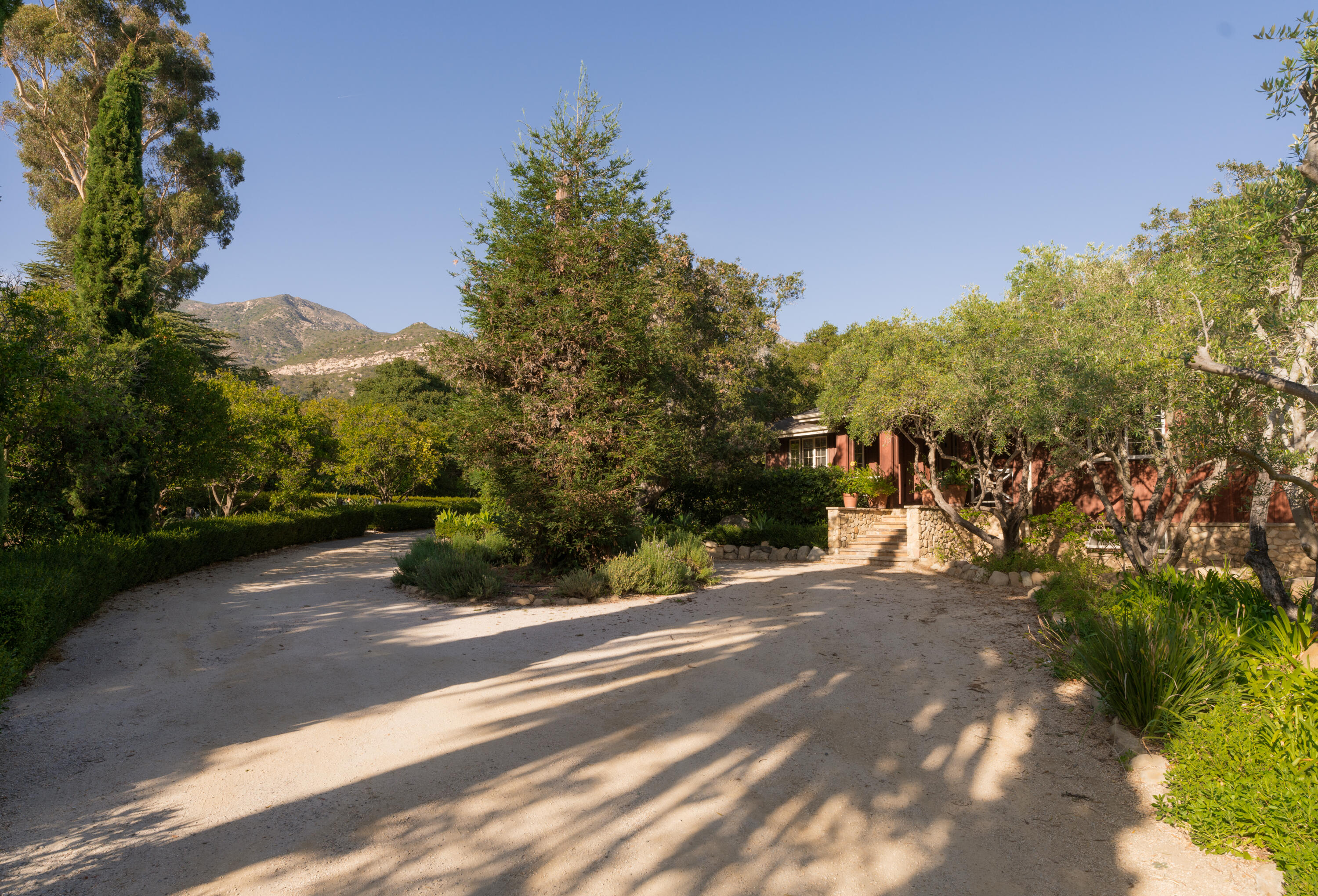690 San Ysidro Road Montecito, CA 93108 - Photo 32 of 34 a view of a street with a building in the background