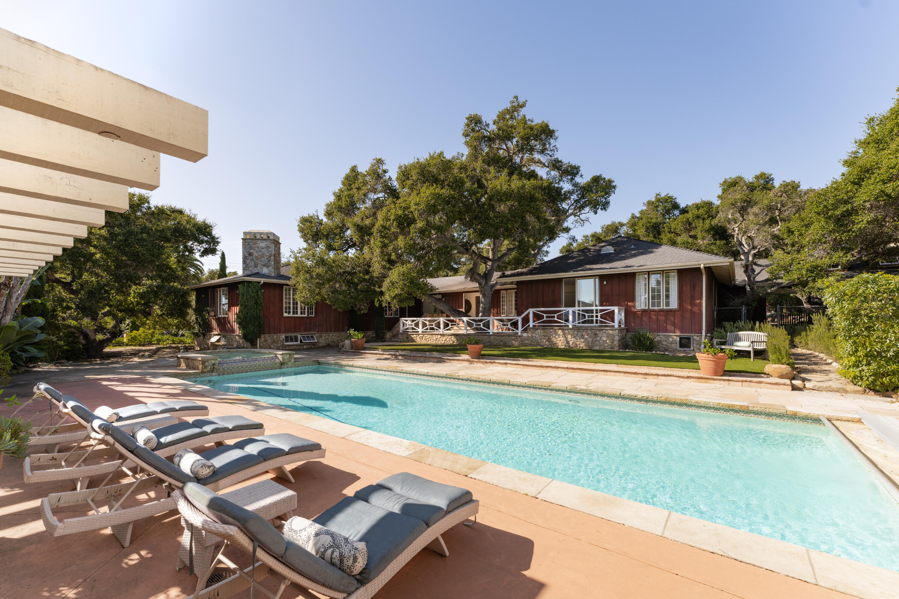 690 San Ysidro Road Montecito, CA 93108 - Photo 4 of 34 a front view of a house with swimming pool having outdoor seating