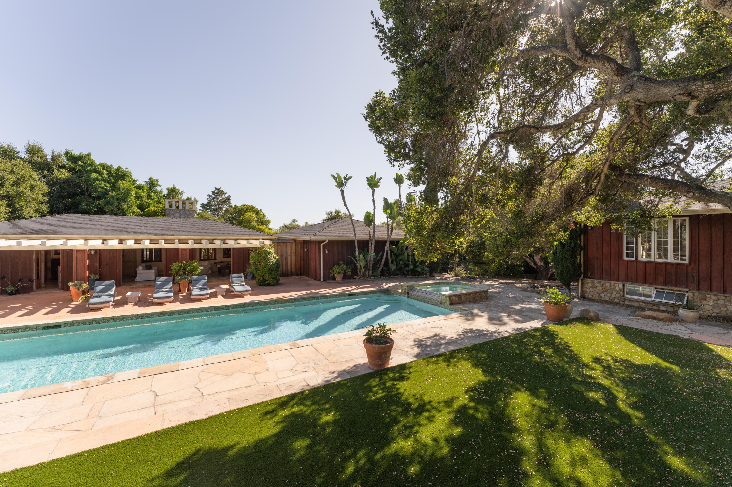 690 San Ysidro Road Montecito, CA 93108 - Photo 7 of 34 a view of a house with swimming pool and yard