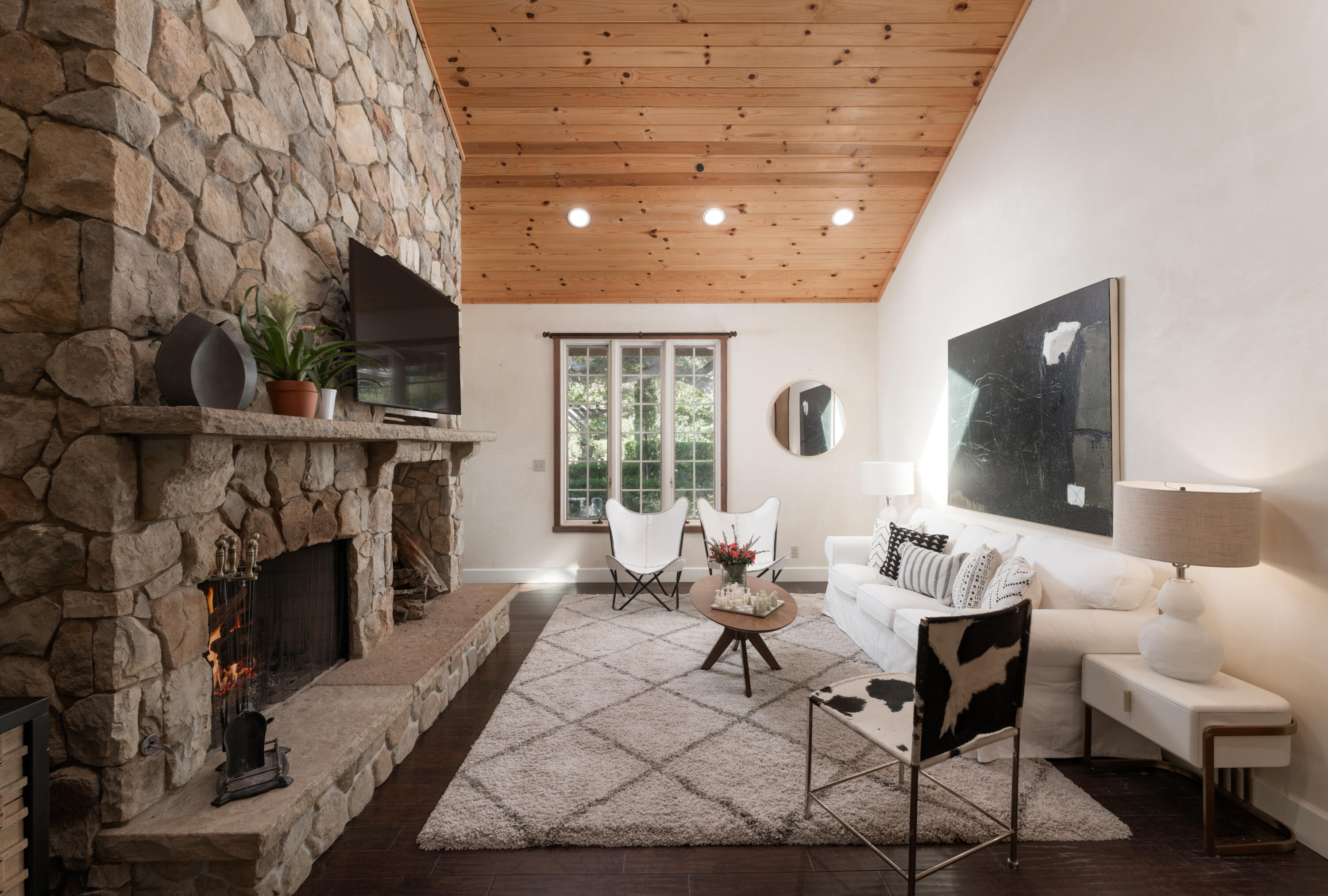 690 San Ysidro Road Montecito, CA 93108 - Photo 10 of 34 a living room with furniture and a fireplace