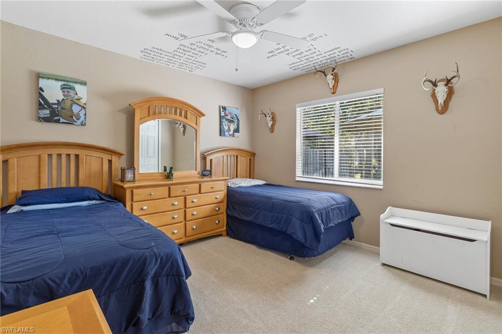 220 18th Avenue Northwest Naples, FL 34120 - Photo 11 of 18 a bedroom with bed and a window