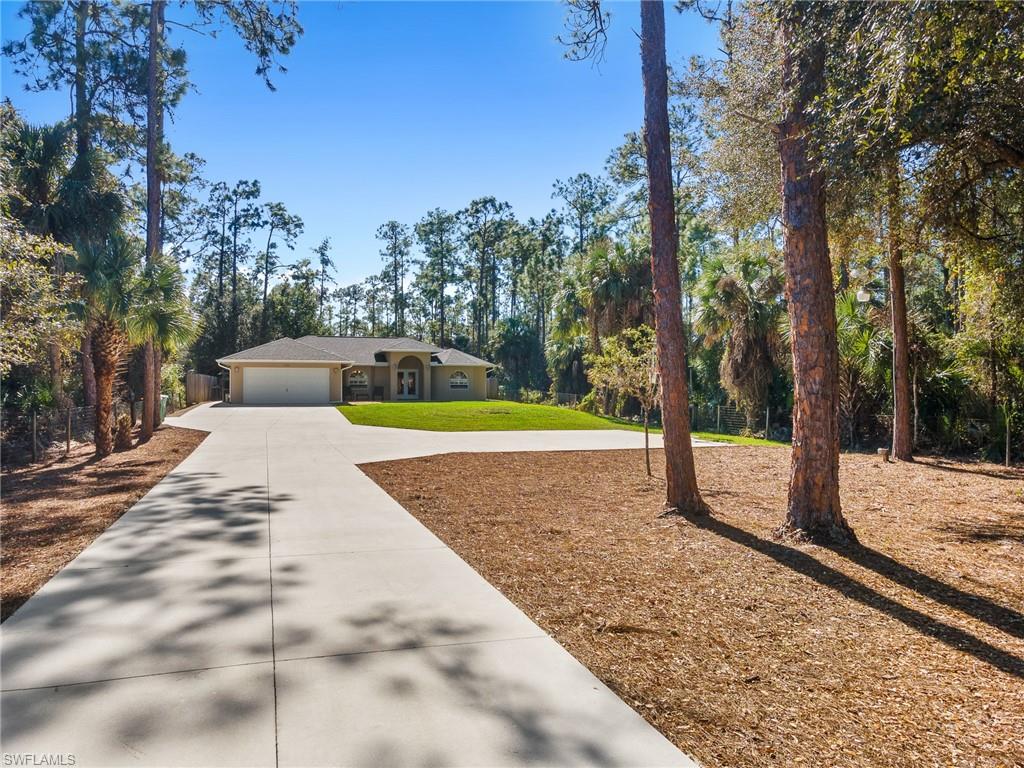 220 18th Avenue Northwest Naples, FL 34120 - Photo 18 of 18 a view of a yard with plants