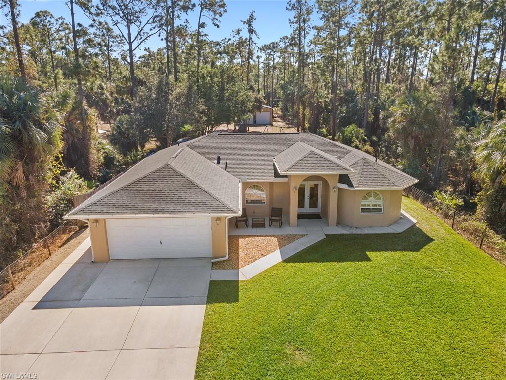220 18th Avenue Northwest Naples, FL 34120 - Photo 3 of 18 a house view with a outdoor space