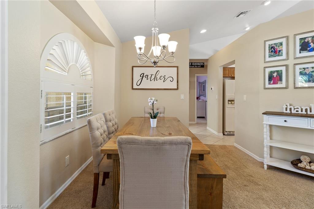 220 18th Avenue Northwest Naples, FL 34120 - Photo 8 of 18 a bathroom with a sink a mirror and a window