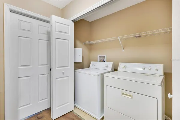 a view of storage and utility room with washer and dryer