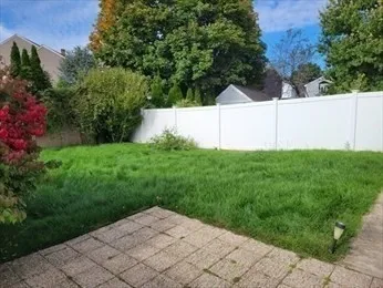 a backyard of a house with lots of green space