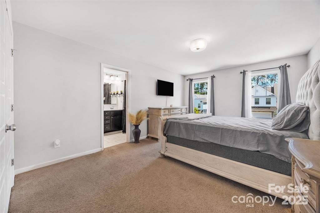 1117 Streamside Lane York, SC 29745 - Photo 12 of 21 a bedroom with a bed and a flat tv screen