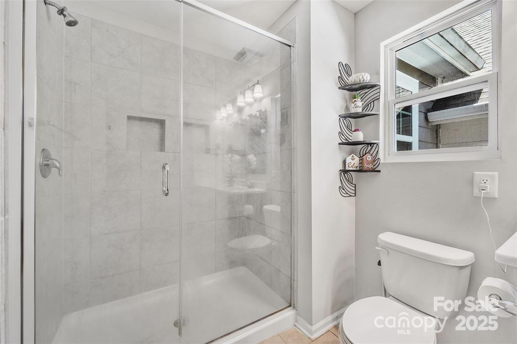 1117 Streamside Lane York, SC 29745 - Photo 15 of 21 a bathroom with a toilet and shower