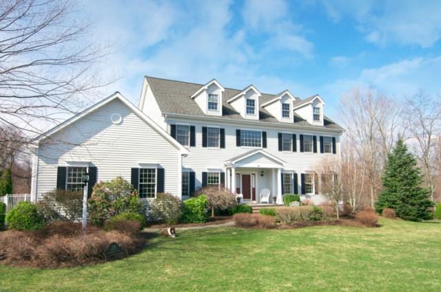 28 Encampment Place Ridgefield, CT 06877 - Photo 1 of 1 a front view of a house with a garden