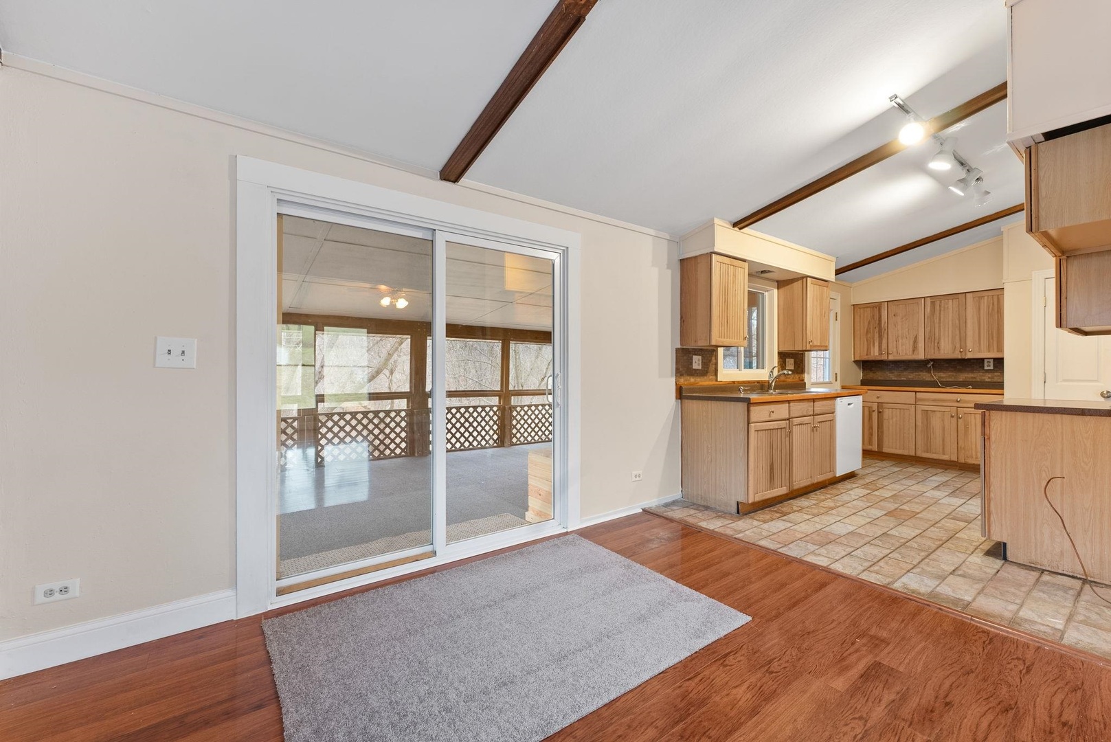 1920 River Vista Road Muscatine, IA 52761 - Photo 11 of 24 a view of a kitchen with wooden floor and electronic appliances