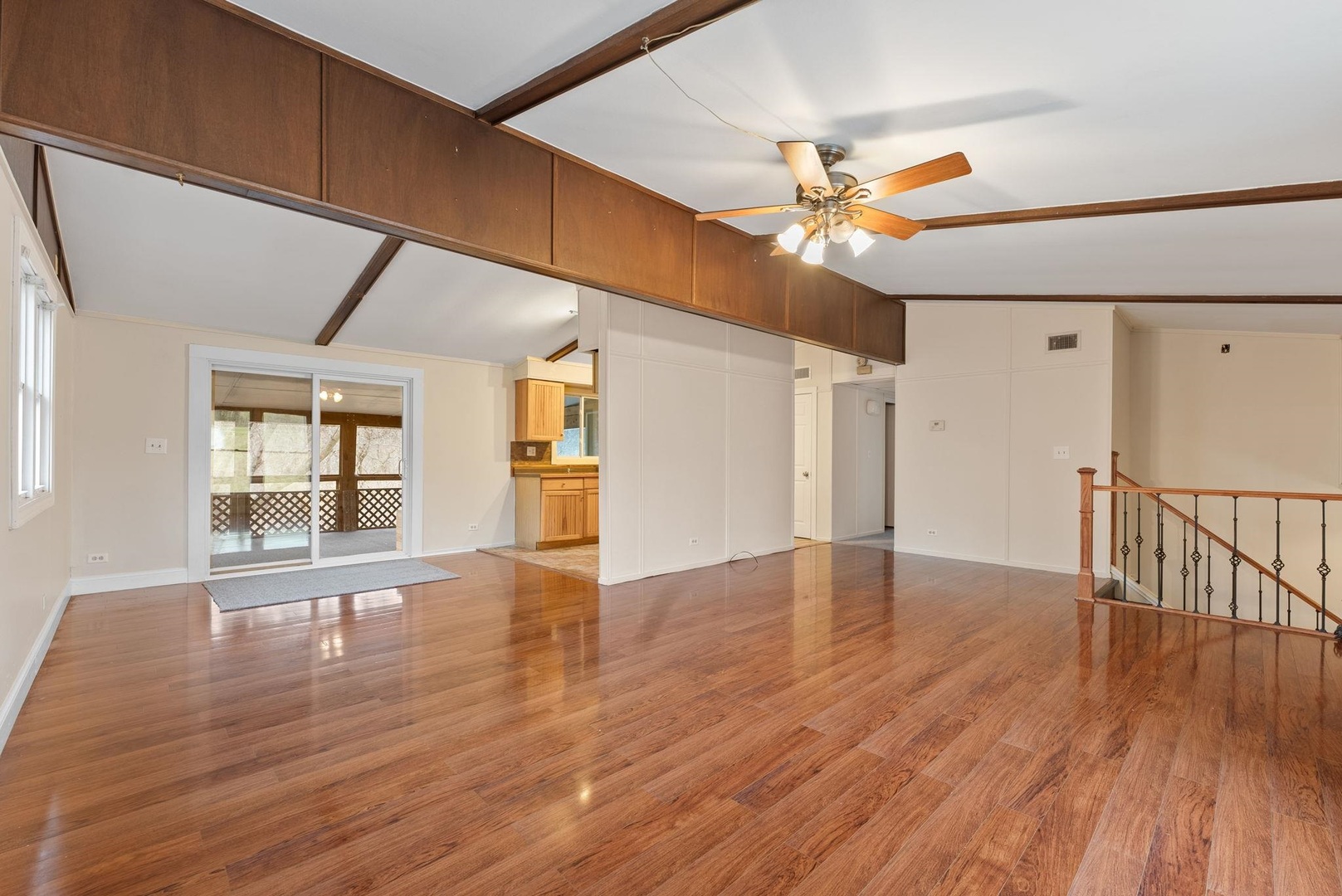 1920 River Vista Road Muscatine, IA 52761 - Photo 8 of 24 a view of an empty room with window and wooden floor