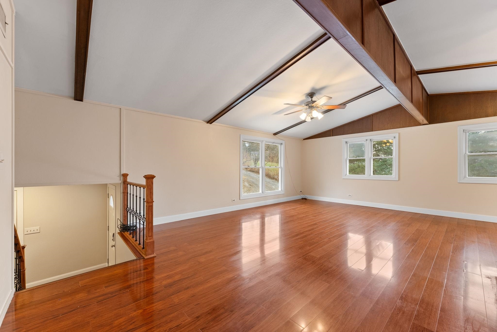 1920 River Vista Road Muscatine, IA 52761 - Photo 9 of 24 a view of an empty room with wooden floor and a window