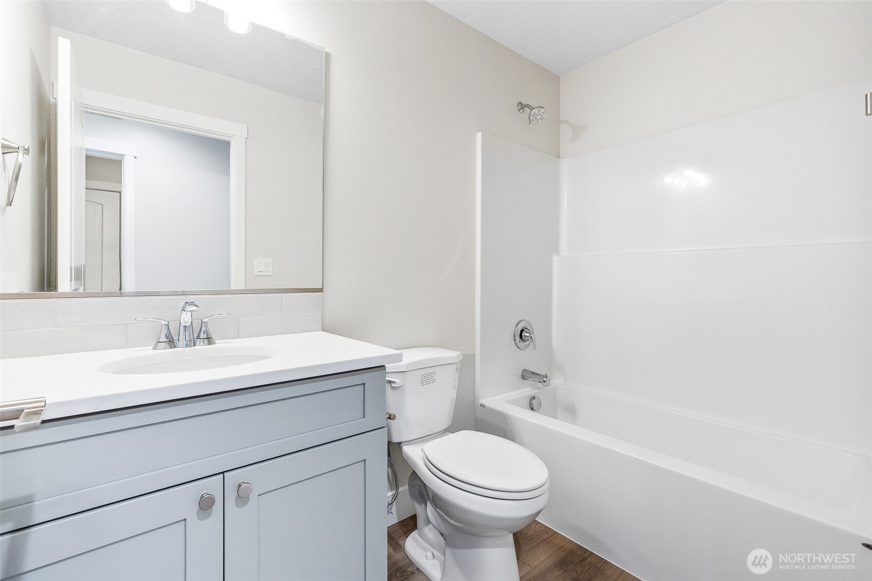 4246 Sandy Street Moses Lake, WA 98837 - Photo 17 of 29 a bathroom with a sink a toilet and a mirror